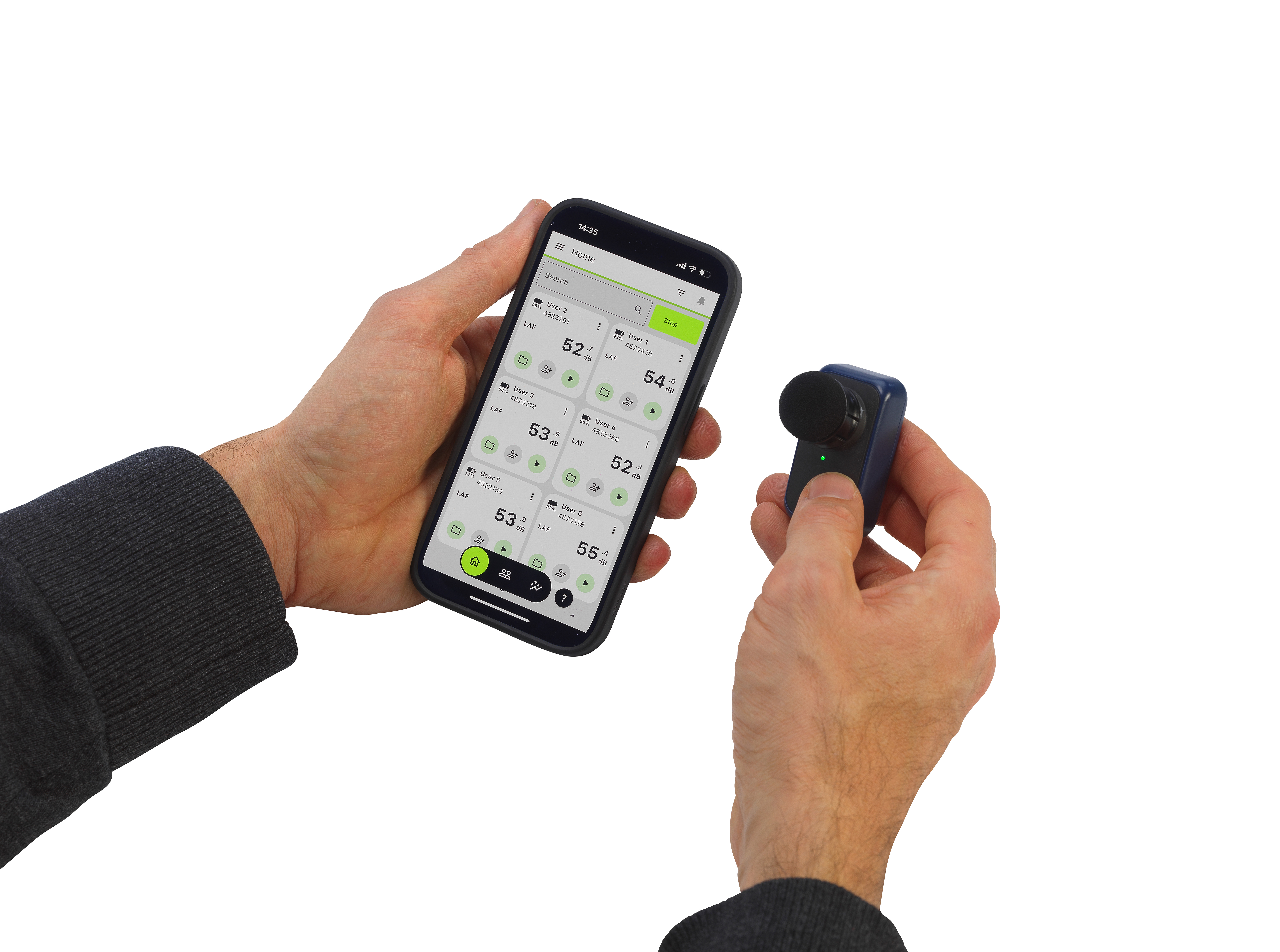 A person holds a smartphone displaying air quality data in one hand and a small portable air quality monitor with a microphone-shaped sensor in the other hand.