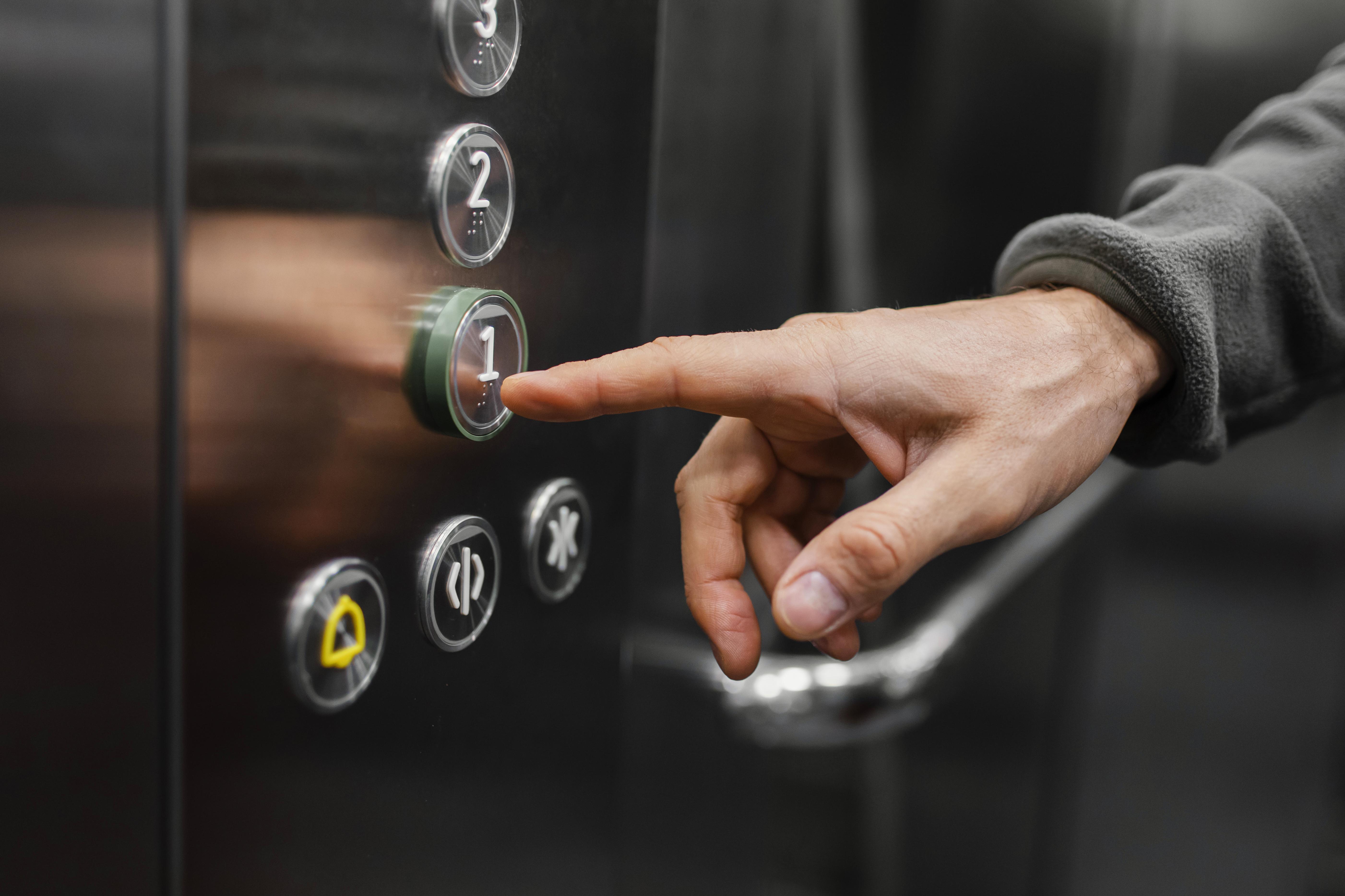 elevator/lift button being pushed