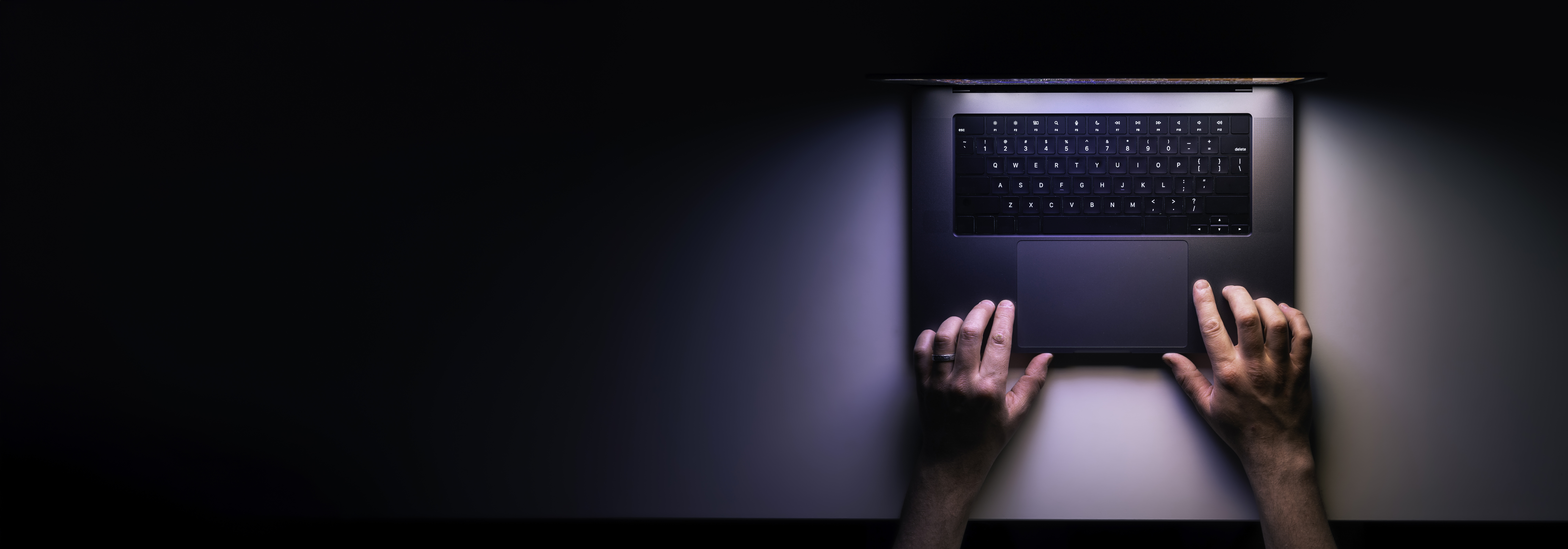 Birds eye view of someone typing on laptop