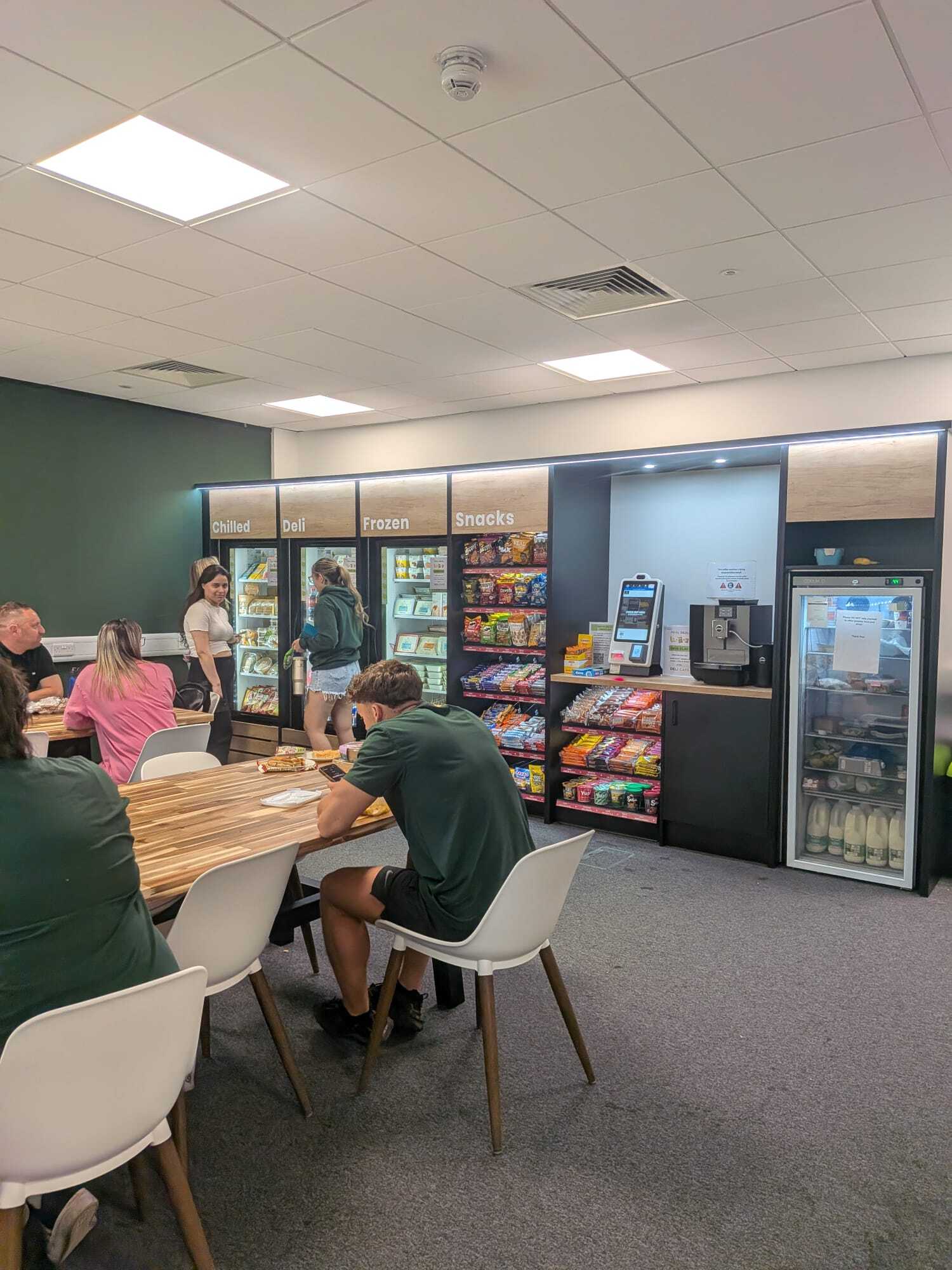 People eating lunch in the manual micro market
