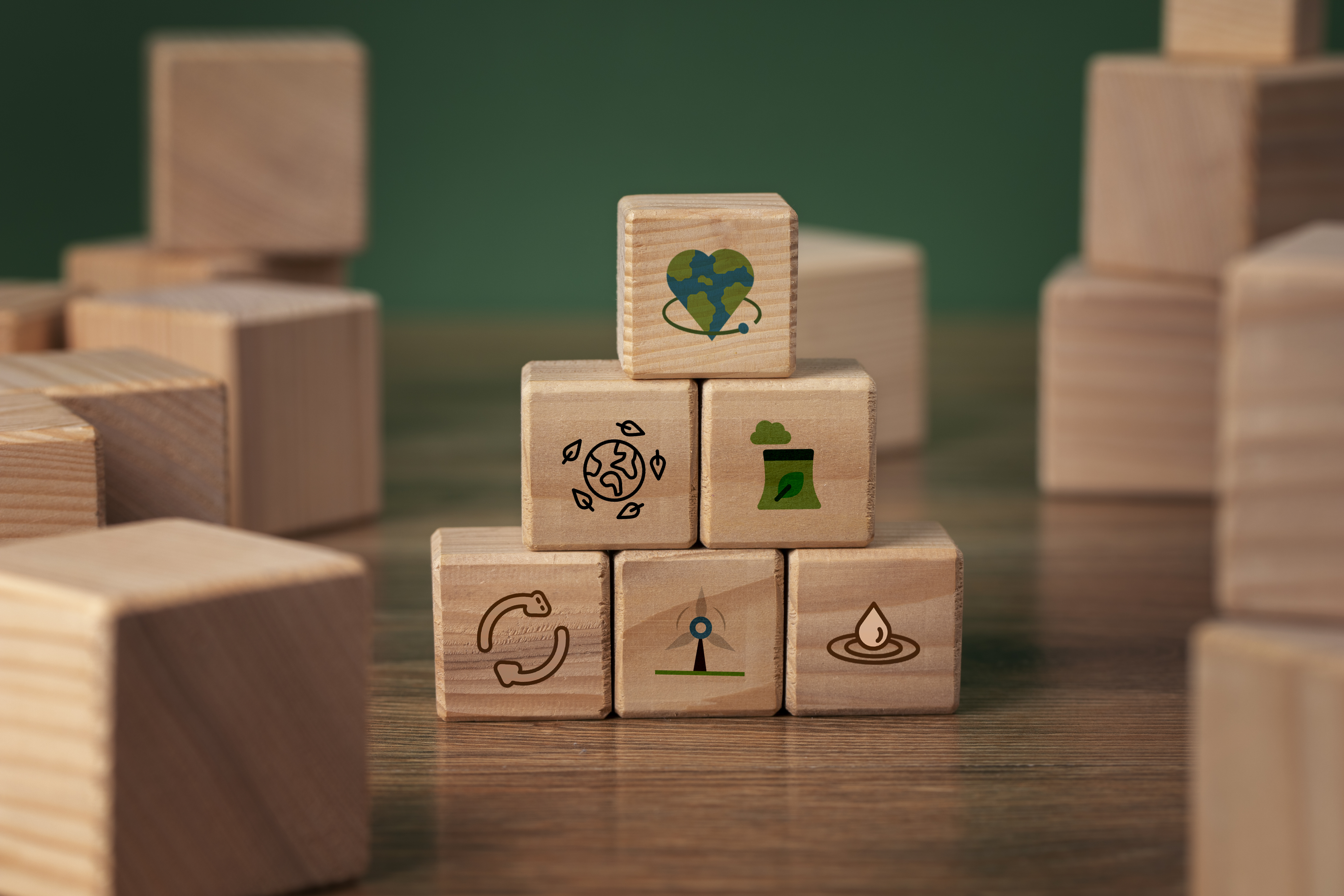 building blocks with net zero/ eco friendly icon goals printed on them