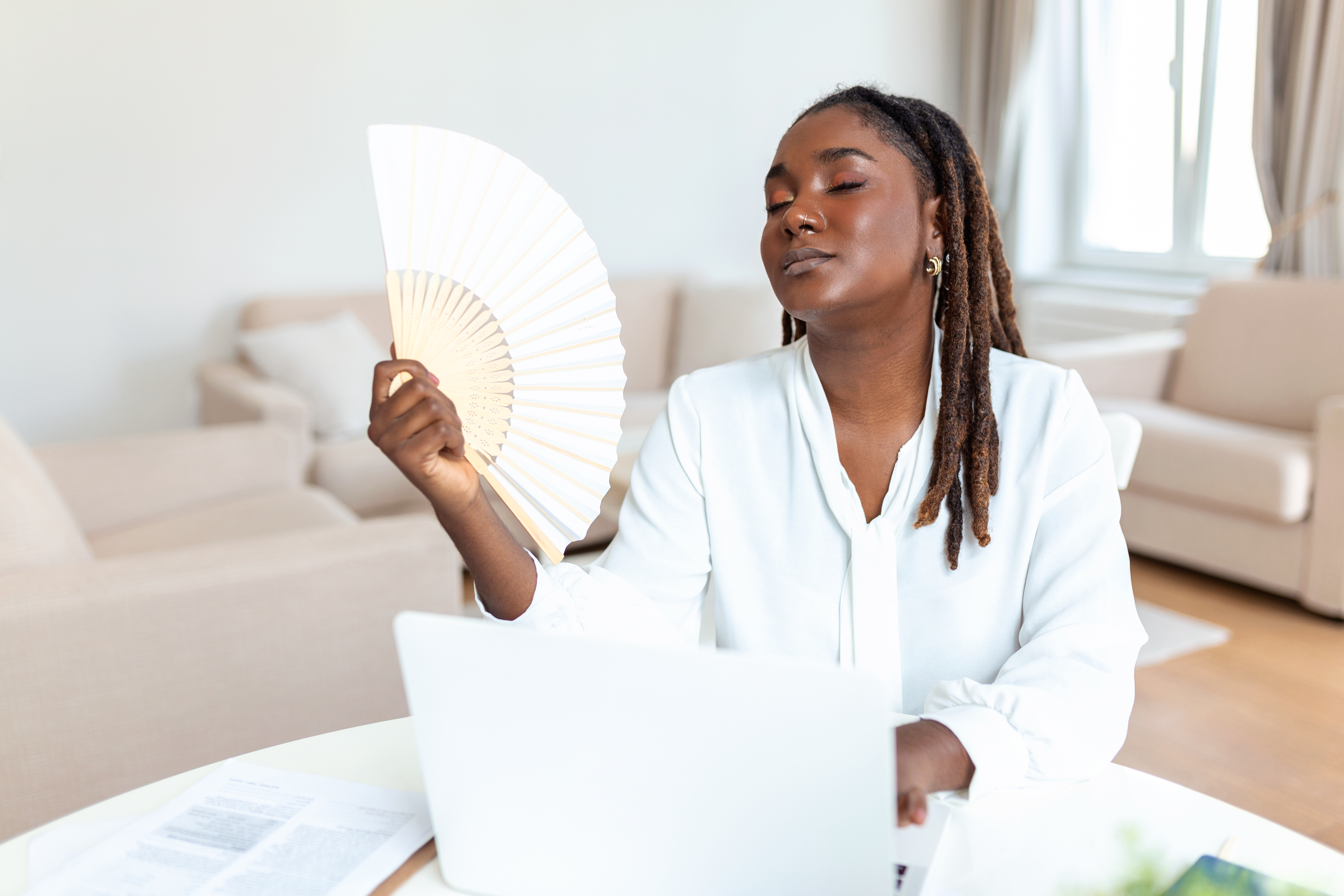 Woman working with a fan